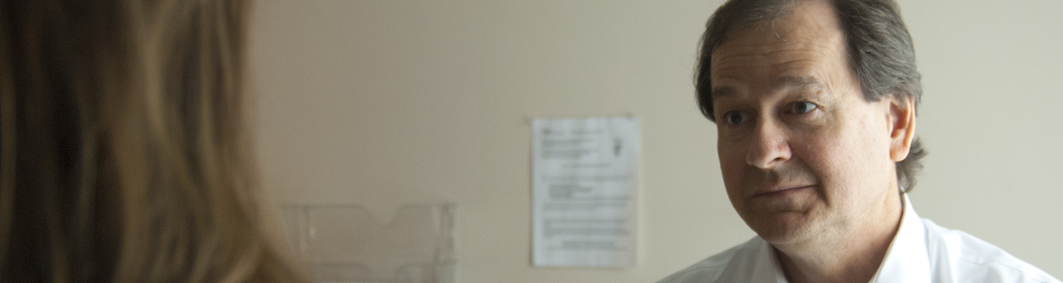 Image of John talking with doctor